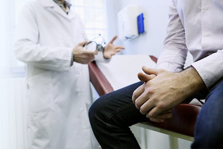 Doctor discussing prostate cancer screenings with a male patient